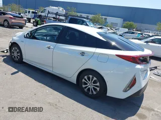 2021 Toyota Prius LE z VIN JTDKAMFP3M3187644, wystawiony jako IAAI lot #42443171 z przebiegiem 126 977 mil mil oraz . Historia ofert i sprzedaży dostępna na DreamBid. Obrazek 3.