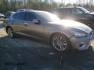2020 Infiniti Q50 with VIN JN1EV7AR9LM256845, listed as a Copart auction lot 48957995 with 56,980 mi miles and Salvage Title. Bid and sale history available at DreamBid. Image 4.
