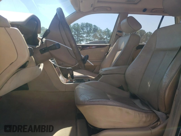 2001 Mercedes-Benz E-Class AWD with VIN WDBJH82J91X057063, listed as a Copart auction lot 70235274 with 174,846 mi miles and Salvage Title. Bid and sale history available at carsss.com. Image 7.