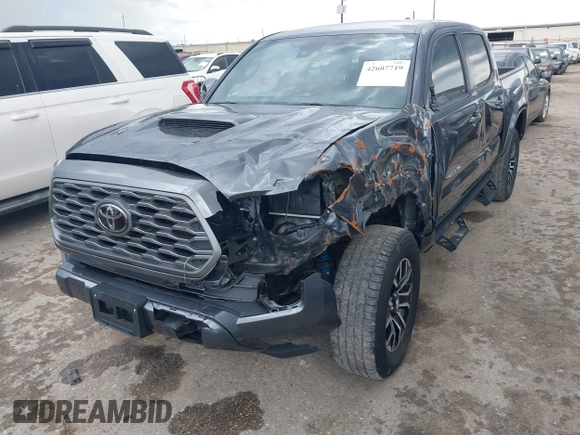 2022 Toyota Tacoma SR5 with VIN 3TMAZ5CN6NM186713, listed as a IAAI auction lot 42607719 with 60,704 mi miles and . Bid and sale history available at DreamBid. Image 2.