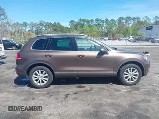 2014 Volkswagen Touareg Sport with VIN WVGEF9BP7ED003525, listed as a IAAI auction lot 41868307 with 74,379 mi miles and . Bid and sale history available at DreamBid. Image 13.