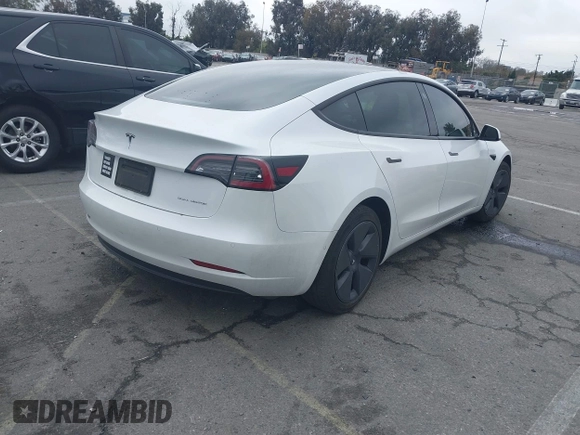 2021 Tesla Model 3 Long Range with VIN 5YJ3E1EB6MF878957, listed as a IAAI auction lot 41915482 with 59,578 mi miles. Bid and sale history available at carsss.com. Image 4.