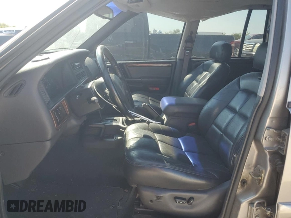 1998 Jeep Grand Cherokee Limited with VIN 1J4GZ78S5WC325148, listed as a Copart auction lot 67780424 with Not provided miles and Salvage title. Bid and sale history available at DreamBid. Image 7.