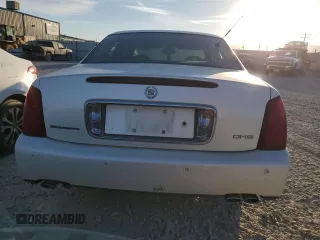 2001 Cadillac DeVille DHS z VIN 1G6KE57Y31U229255, wystawiony jako Copart lot #75101214 z przebiegiem 141 187 mil mil oraz Czysty tytuł • Clean title. Historia ofert i sprzedaży dostępna na DreamBid. Obrazek 6.