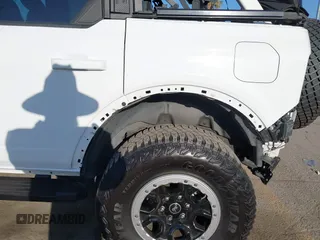 2021 Ford Bronco z VIN 1FMEE5DP7MLA93692, wystawiony jako IAAI lot #42222219 z przebiegiem 18 982 mil mil oraz . Historia ofert i sprzedaży dostępna na DreamBid. Obrazek 6.