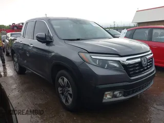 2018 Honda Ridgeline RTL-E with VIN 5FPYK3F74JB012181, listed as a IAAI auction lot 42143197 with 117,520 mi miles and . Bid and sale history available at DreamBid. Image 1.