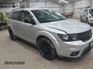 2013 Dodge Journey SXT with VIN 3C4PDCBBXDT661479, listed as a IAAI auction lot 42055731 with 151,963 mi miles. Bid and sale history available at carsss.com. Image 1.