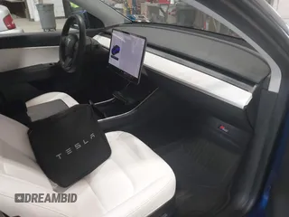 2021 Tesla Model Y Long Range with VIN 5YJYGDEE7MF066269, listed as a IAAI auction lot 42170970 with 70,170 mi miles. Bid and sale history available at carsss.com. Image 5.