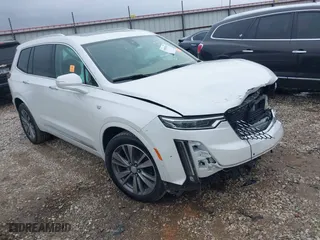 2021 Cadillac XT6 Premium Luxury with VIN 1GYKPFRS0MZ100879, listed as a IAAI auction lot 41083030 with 56,502 mi miles. Bid and sale history available at carsss.com. Image 1.
