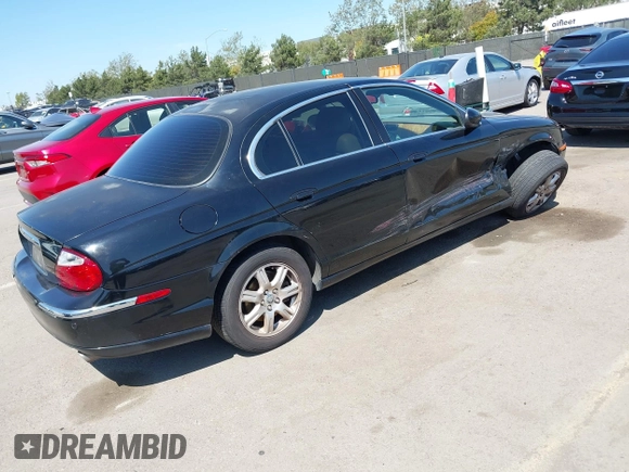 2003 Jaguar S-Type with VIN SAJEA01T13FM70486, listed as a IAAI auction lot 41989501 with 100,109 mi miles and . Bid and sale history available at DreamBid. Image 4.