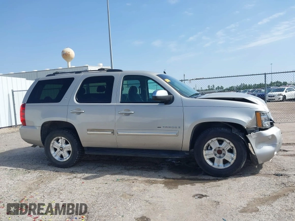2009 Chevrolet Tahoe 2LT z VIN 1GNEC23379R258434, wystawiony jako IAAI lot #41558672 z przebiegiem 133 646 mil mil oraz . Historia ofert i sprzedaży dostępna na DreamBid. Obrazek 13.