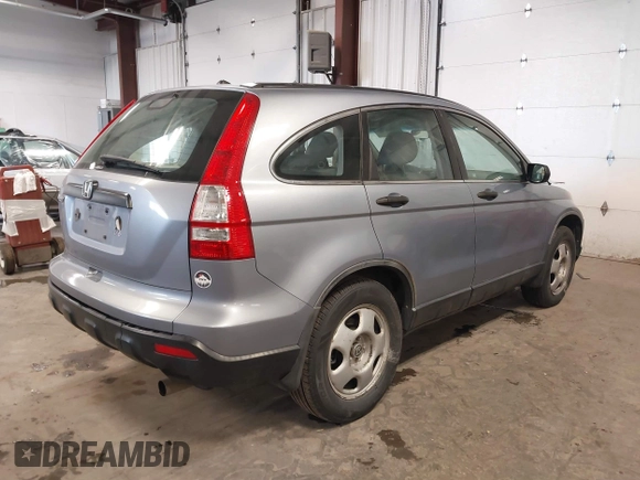 2009 Honda CR-V LX with VIN JHLRE48359C018488, listed as a IAAI auction lot 41824887 with 203,235 mi miles. Bid and sale history available at carsss.com. Image 4.