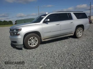 2015 Chevrolet Suburban LT with VIN 1GNSCJKC6FR662416, listed as a Copart auction lot 57032485 with 197,930 mi miles and Salvage title. Bid and sale history available at DreamBid. Image 1.