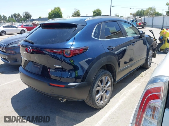 2023 Mazda CX-30 S Select with VIN 3MVDMBBM3PM514030, listed as a IAAI auction lot 42326959 with 41,226 mi miles and . Bid and sale history available at DreamBid. Image 4.