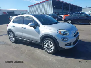 2016 FIAT 500X Lounge z VIN ZFBCFXDT2GP363767, wystawiony jako IAAI lot #37885612 z przebiegiem 74 859 mil mil oraz . Historia ofert i sprzedaży dostępna na DreamBid. Obrazek 1.