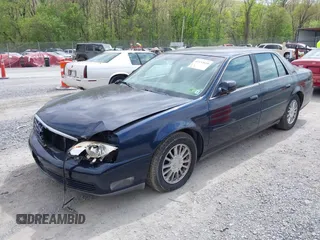 2004 Cadillac DeVille DHS z VIN 1G6KE54Y64U110060, wystawiony jako IAAI lot #42133610 z przebiegiem 68 677 mil mil oraz . Historia ofert i sprzedaży dostępna na DreamBid. Obrazek 2.