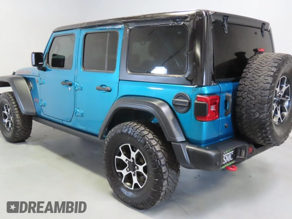 2020 Jeep Wrangler Unlimited Rubicon z VIN 1C4HJXFG0LW141133, wystawiony jako Copart lot #59150925 z przebiegiem 61 973 mil mil oraz Szkoda całkowita • Salvage title. Historia ofert i sprzedaży dostępna na DreamBid. Obrazek 4.