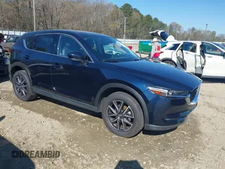 2018 Mazda CX-5 Grand Touring with VIN JM3KFADM1J0322049, listed as a IAAI auction lot 41891079 with 174,939 mi miles and . Bid and sale history available at DreamBid. Image 1.