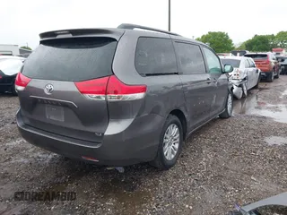 2014 Toyota Sienna XLE with VIN 5TDYK3DC0ES502482, listed as a IAAI auction lot 41910683 with 151,330 mi miles. Bid and sale history available at carsss.com. Image 4.