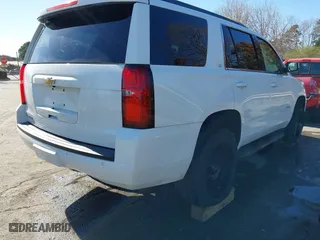 2019 Chevrolet Tahoe LT with VIN 1GNSKBKC7KR307869, listed as a IAAI auction lot 41833834 with 127,949 mi miles. Bid and sale history available at carsss.com. Image 4.
