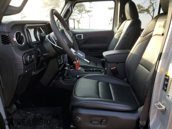 2024 Jeep Wrangler Sahara with VIN 1C4RJXP60RW128448, listed as a Copart auction lot 48658135 with 5,879 mi miles and Salvage Title. Bid and sale history available at DreamBid. Image 7.