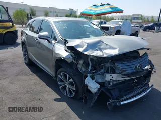 2017 Lexus RX 350 z VIN 2T2ZZMCA3HC041664, wystawiony jako IAAI lot #42379331 z przebiegiem 153 887 mil mil oraz . Historia ofert i sprzedaży dostępna na DreamBid. Obrazek 1.