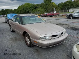 1998 Oldsmobile 88 LS z VIN 1G3HN52K0W4857890, wystawiony jako Copart lot #56019374 z przebiegiem 170 105 mil mil oraz Szkody całkowita. Historia ofert i sprzedaży dostępna na DreamBid. Obrazek 1.