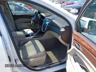 2014 Cadillac SRX Performance Collection with VIN 3GYFNFE35ES582897, listed as a IAAI auction lot 41978361 with 144,116 mi miles and . Bid and sale history available at DreamBid. Image 5.