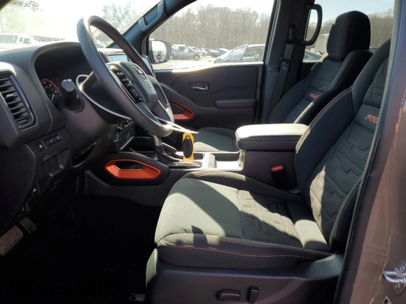2024 Nissan Frontier Pro-4X with VIN 1N6ED1EK2RN656885, listed as a Copart auction lot 46604165 with 4,390 mi miles and Salvage title. Bid and sale history available at DreamBid. Image 7.