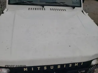 1990 Mitsubishi Montero z VIN JA4GJ31S2LJ003083, wystawiony jako Copart lot #73539314 z przebiegiem 115 191 mil mil oraz Nie do naprawy • Non repairable. Historia ofert i sprzedaży dostępna na DreamBid. Obrazek 12.