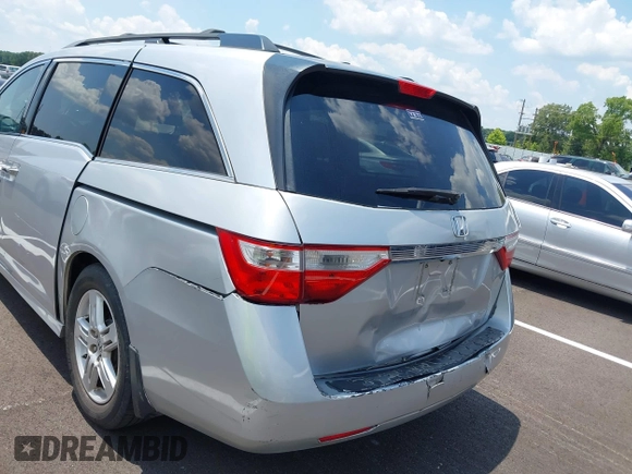 2011 Honda Odyssey Touring with VIN 5FNRL5H99BB058448, listed as a IAAI auction lot 42651432 with 208,581 mi miles and . Bid and sale history available at DreamBid. Image 6.