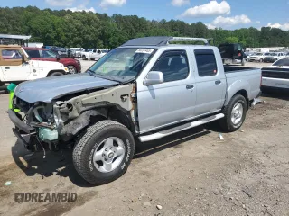 2001 Nissan Frontier SE with VIN 1N6ED27T51C311894, listed as a Copart auction lot 56281465 with 151,361 mi miles and Salvage title. Bid and sale history available at DreamBid. Image 1.