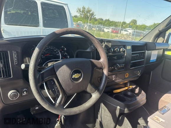 2014 Chevrolet Express Cargo with VIN 1GCWGFCA8E1121812, listed as a IAAI auction lot 42801147 with 128,506 mi miles and . Bid and sale history available at DreamBid. Image 9.