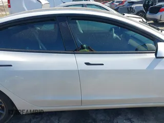 2023 Tesla Model 3 Long Range with VIN 5YJ3E1EB1PF393565, listed as a IAAI auction lot 41656060 with 16,236 mi miles and . Bid and sale history available at DreamBid. Image 13.