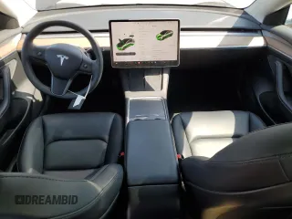 2023 Tesla Model 3 with VIN 5YJ3E1EA3PF695267, listed as a Copart auction lot 52559645 with 9,025 mi miles and Salvage title. Bid and sale history available at DreamBid. Image 8.