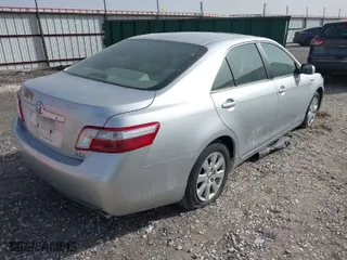 2007 Toyota Camry Hybrid with VIN JTNBB46K473000672, listed as a IAAI auction lot 41841447 with 216,474 mi miles. Bid and sale history available at carsss.com. Image 4.