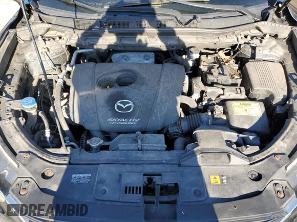 2016 Mazda CX-5 Sport with VIN JM3KE2BE1G0629430, listed as a Copart auction lot 82442654 with 130,289 mi miles and Salvage Title. Bid and sale history available at DreamBid. Image 12.