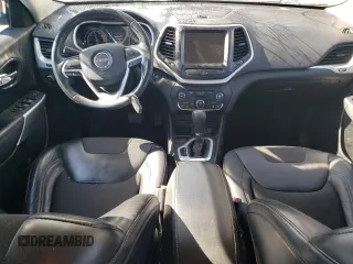 2018 Jeep Cherokee Latitude Plus with VIN 1C4PJLLXXJD557028, listed as a Copart auction lot 76671214 with 105,459 mi miles and Salvage Title. Bid and sale history available at carsss.com. Image 8.