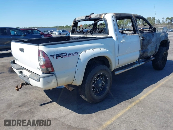 2014 Toyota Tacoma with VIN 5TFLU4EN0EX098815, listed as a IAAI auction lot 41675606 with 89,365 mi miles. Bid and sale history available at carsss.com. Image 4.