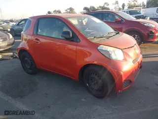 2013 Scion iQ with VIN JTNJJXB02DJ022231, listed as a IAAI auction lot 41238766 with 98,300 mi miles. Bid and sale history available at carsss.com. Image 1.