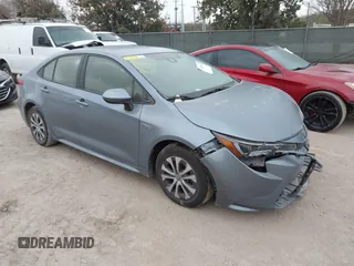 2021 Toyota Corolla Hybrid LE with VIN JTDEAMDE8MJ002711, listed as a IAAI auction lot 41498716 with 98,559 mi miles. Bid and sale history available at carsss.com. Image 1.
