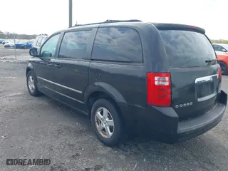 2010 Dodge Grand Caravan SXT with VIN 2D4RN5D11AR201781, listed as a IAAI auction lot 42028688 with 147,563 mi miles. Bid and sale history available at carsss.com. Image 3.