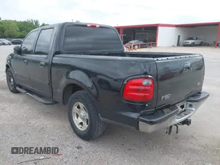 2002 Ford F-150 XLT with VIN 1FTRW07692KE26387, listed as a IAAI auction lot 42079023 with 218,876 mi miles. Bid and sale history available at carsss.com. Image 3.