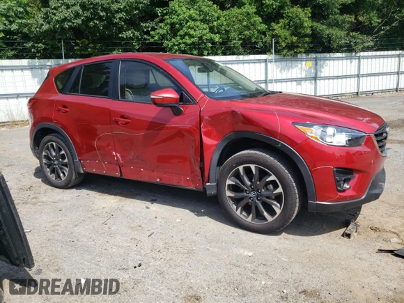 2016 Mazda CX-5 Grand Touring z VIN JM3KE2DY0G0722334, wystawiony jako Copart lot #59998185 z przebiegiem 51 449 mil mil oraz Szkoda całkowita • Salvage title. Historia ofert i sprzedaży dostępna na DreamBid. Obrazek 4.