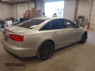 2014 Audi A6 Premium Plus with VIN WAUFGAFC7EN146819, listed as a IAAI auction lot 42072873 with 151,036 mi miles and . Bid and sale history available at DreamBid. Image 4.