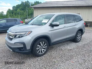 2021 Honda Pilot EX-L with VIN 5FNYF6H50MB063465, listed as a IAAI auction lot 42160636 with 28,595 mi miles and . Bid and sale history available at DreamBid. Image 2.