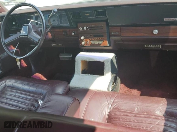 1987 Chevrolet Caprice z VIN 1G1BU51H7H9156079, wystawiony jako Copart lot #60443124 z przebiegiem 44 452 mil mil oraz Szkoda całkowita • Salvage title. Historia ofert i sprzedaży dostępna na DreamBid. Obrazek 8.