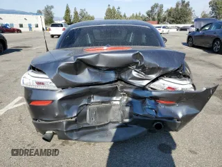 2014 BMW Z4 sDrive35i with VIN WBALM7C50EE385780, listed as a Copart auction lot 74046914 with 88,766 mi miles and Salvage Title. Bid and sale history available at carsss.com. Image 6.