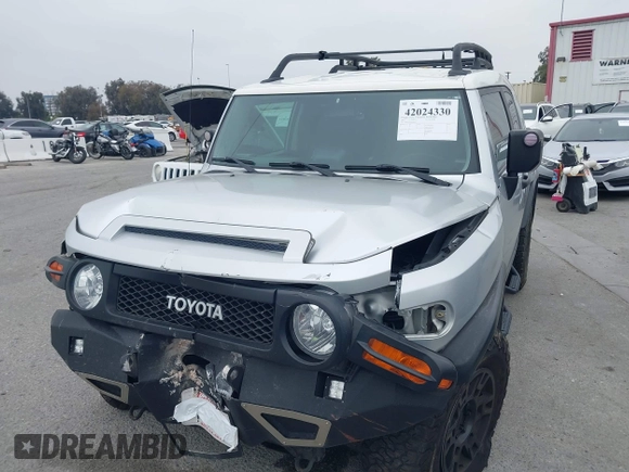 2007 Toyota FJ Cruiser with VIN JTEBU11F370036941, listed as a IAAI auction lot 42024330 with 164,703 mi miles. Bid and sale history available at carsss.com. Image 2.