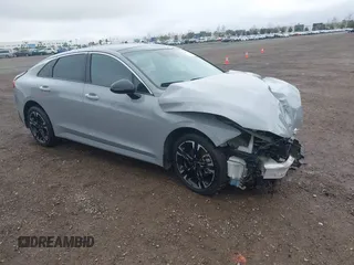 2022 Kia K5 GT-Line z VIN 5XXG64J29NG116128, wystawiony jako IAAI lot #41499749 z przebiegiem 27 891 mil mil oraz . Historia ofert i sprzedaży dostępna na DreamBid. Obrazek 1.